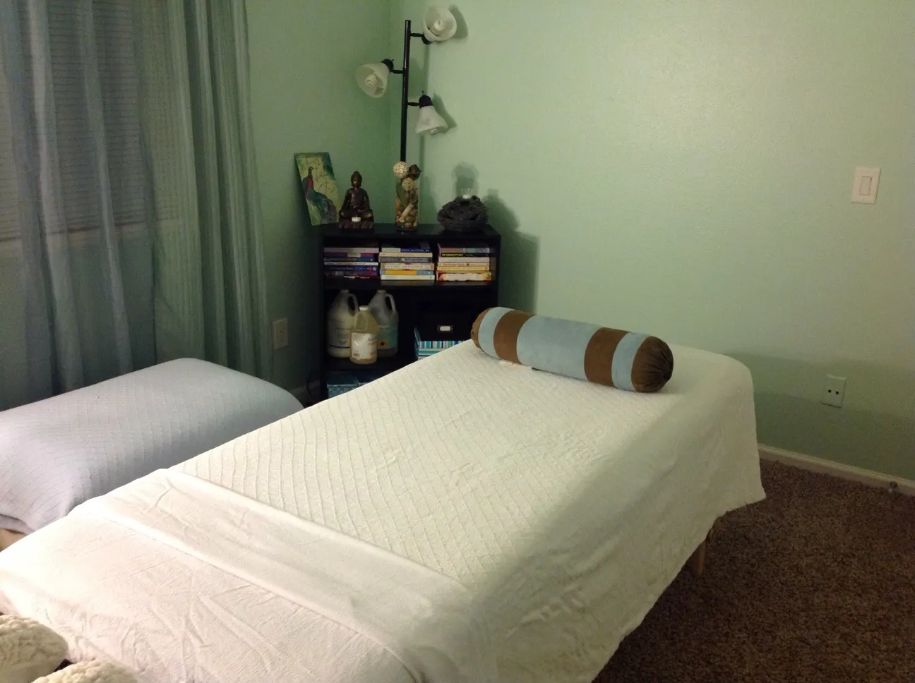 Massage table setup in a calm, home-based setting — reflective of my current in-home perinatal massage care.