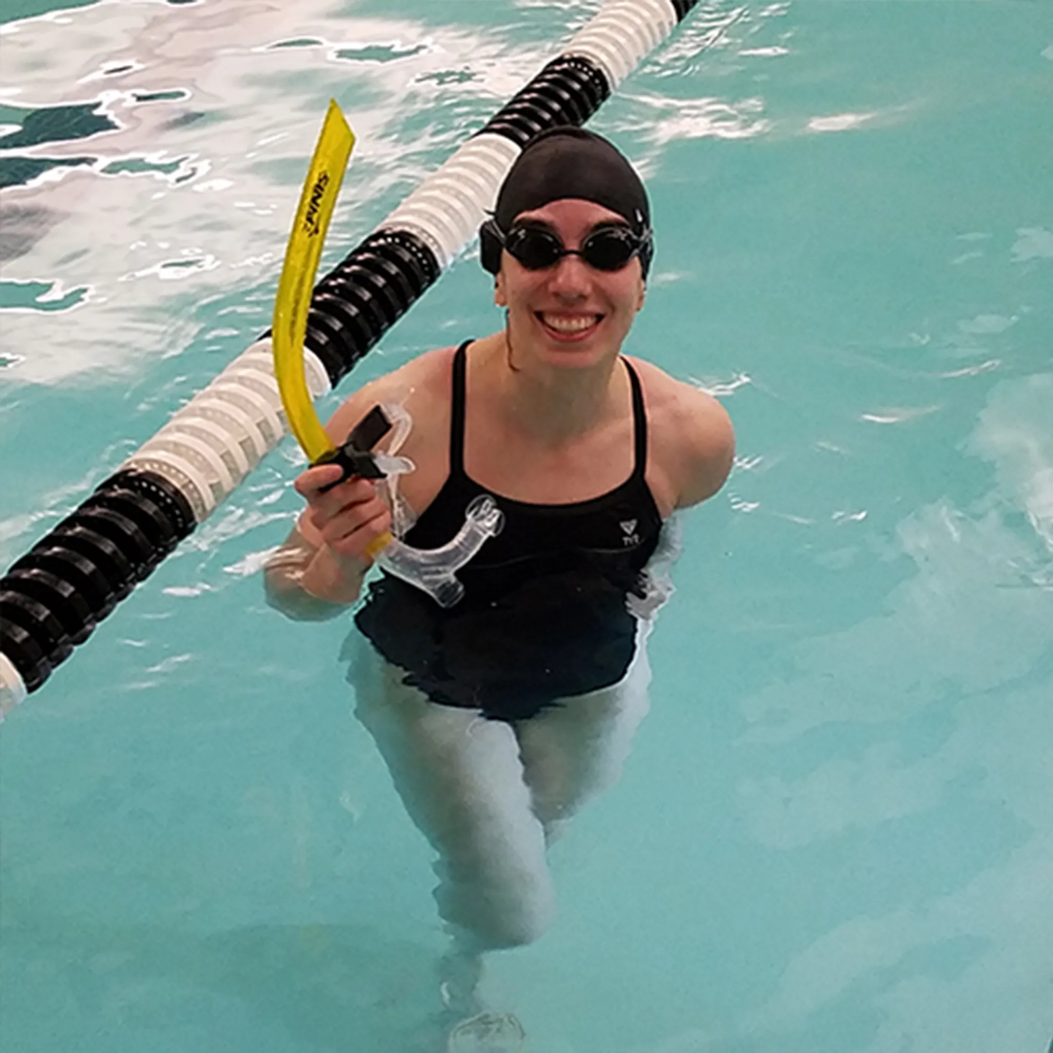 Swimming for stress relief and overall well-being: A woman enjoys a refreshing pool session.