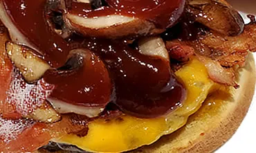 Tri-Tip Bacon Cheese Burger With BBQ Sauce and Mushrooms on a Toasted Bun