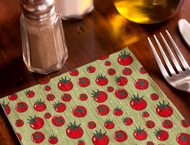 placemat with tomatoes by a salt shaker