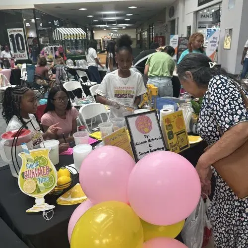 Young entrepreneurs selling products