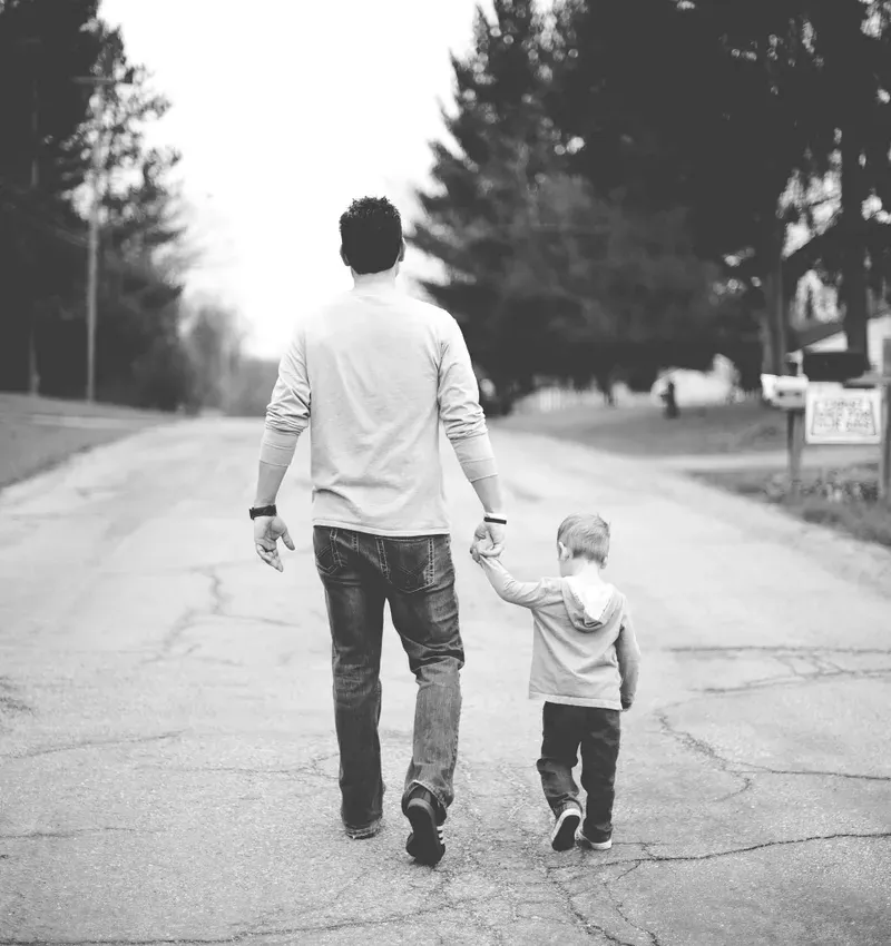 man walking with son