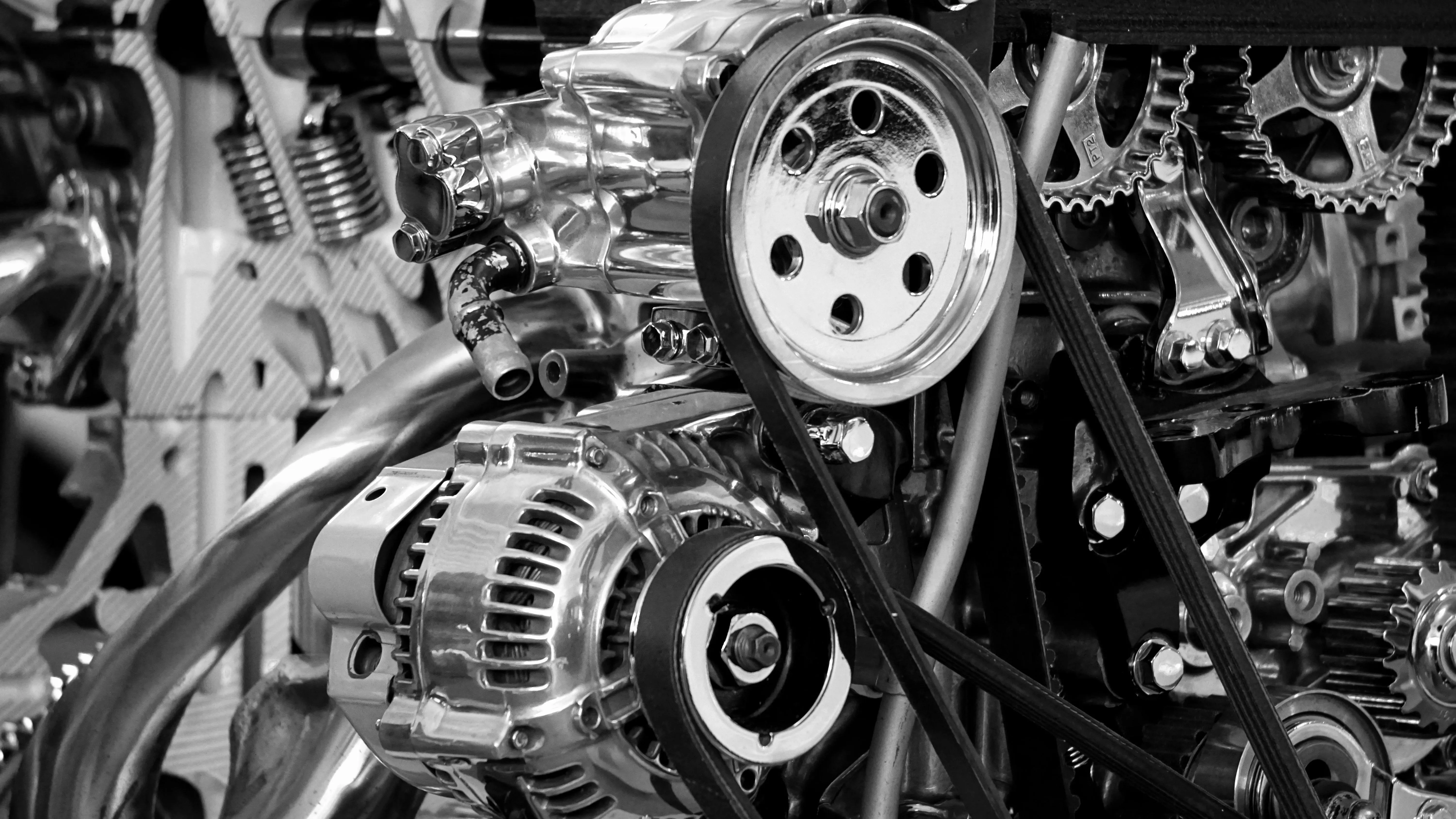 Black‑and‑white close‑up of a high‑horsepower engine with exposed gears, polished metal, and intricate mechanical components, symbolizing power, precision, and a system built on verifiable performance. The image represents a Proof‑of‑Work Ledger evolving into a reputation engine—driven by receipts, discipline, and visible proof.