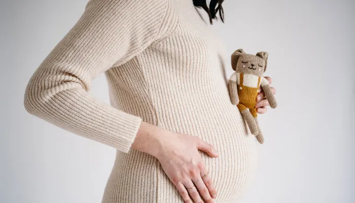 A woman pregnant with a baby.