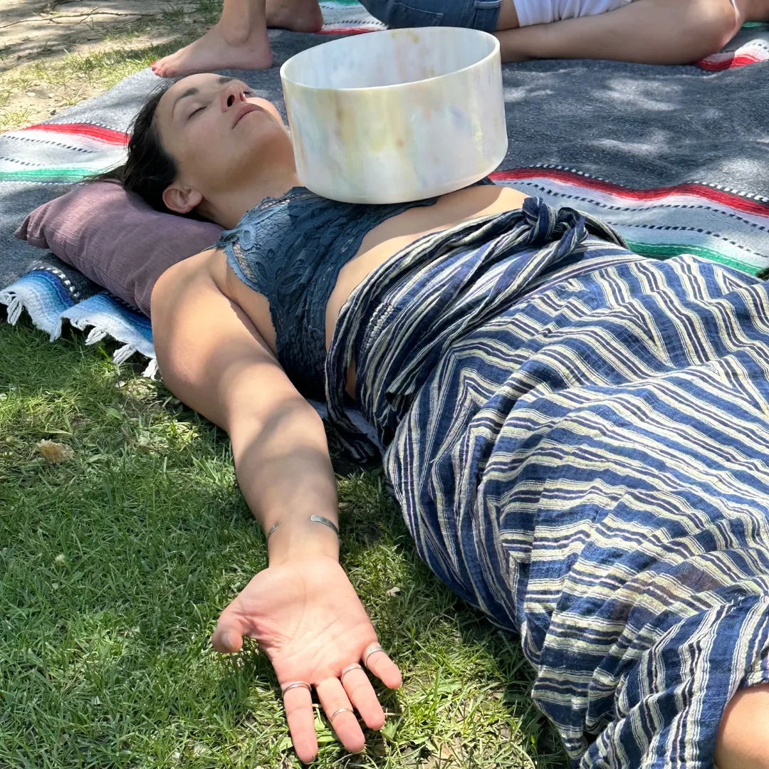 Performing Sound Bath with Crystal Bowl on Participant