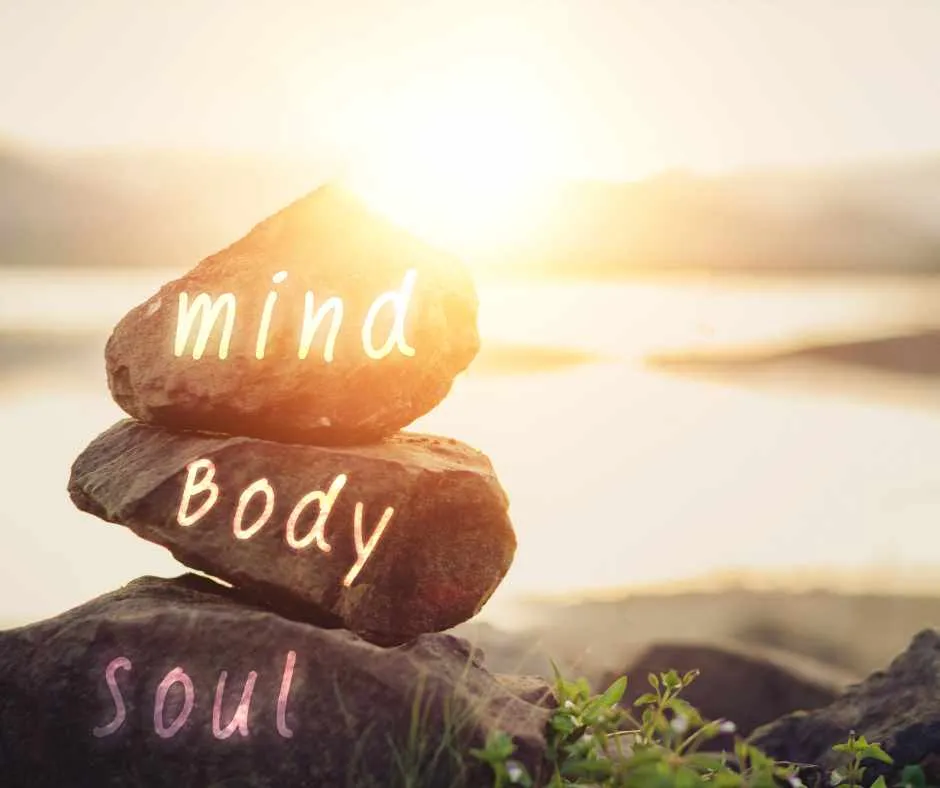 Mind body soul rocks in front of water