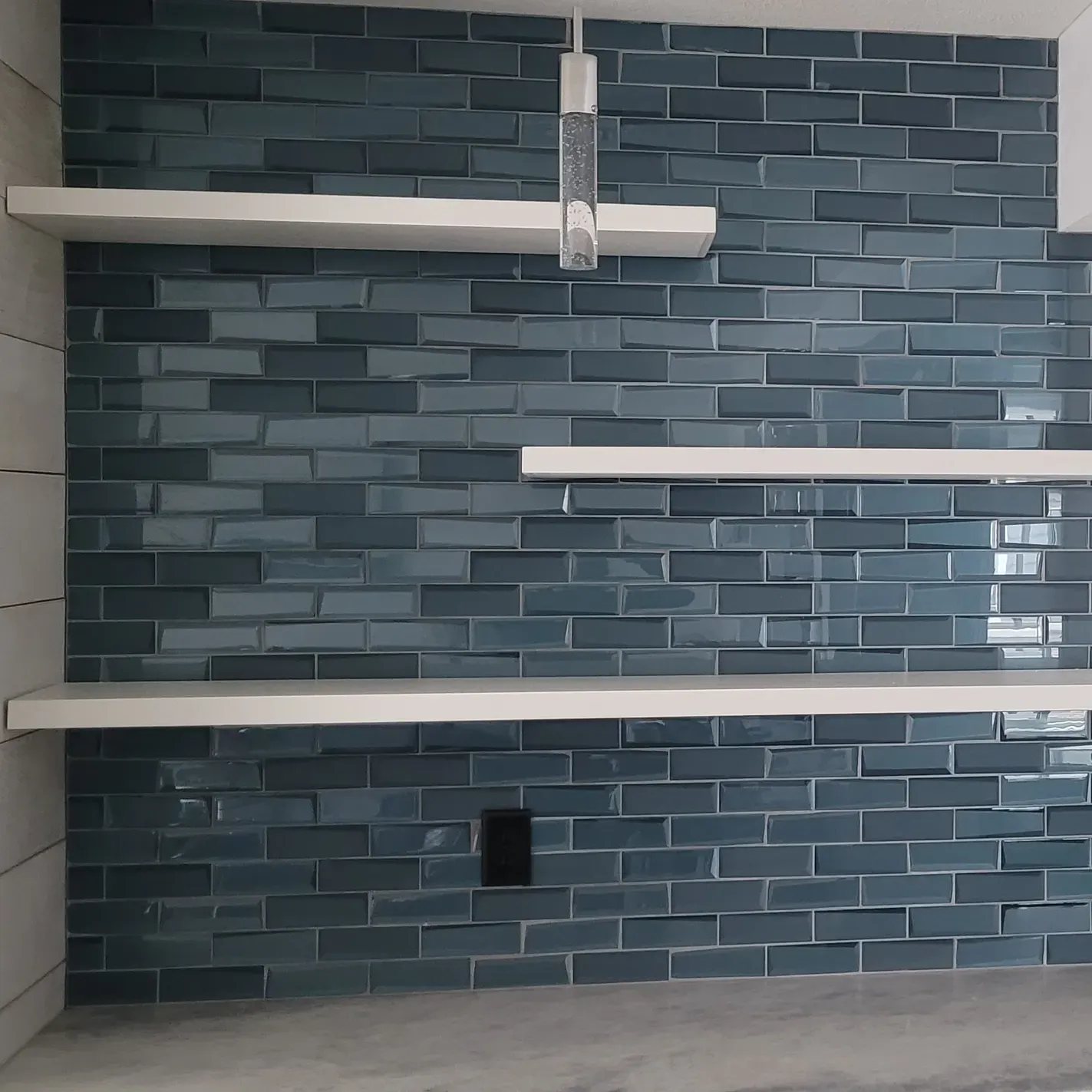 Custom shelves on glass tile in a kitchen 