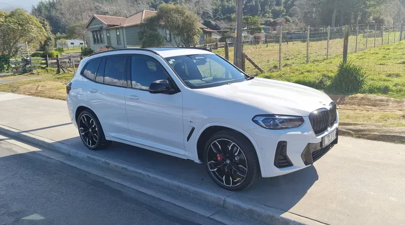 A white BMW X5 luxury SUV, meticulously detailed and parked in Rotorua, showcasing the expert detailing services of HGD Detailing.