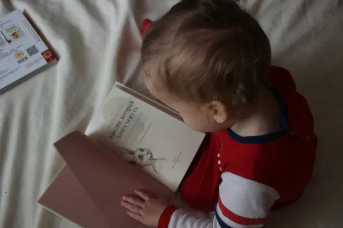 baby reading a book