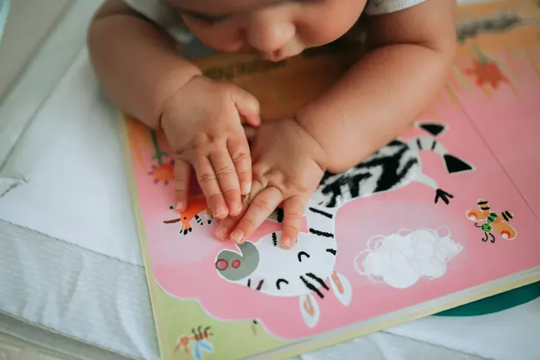 baby looking at a book