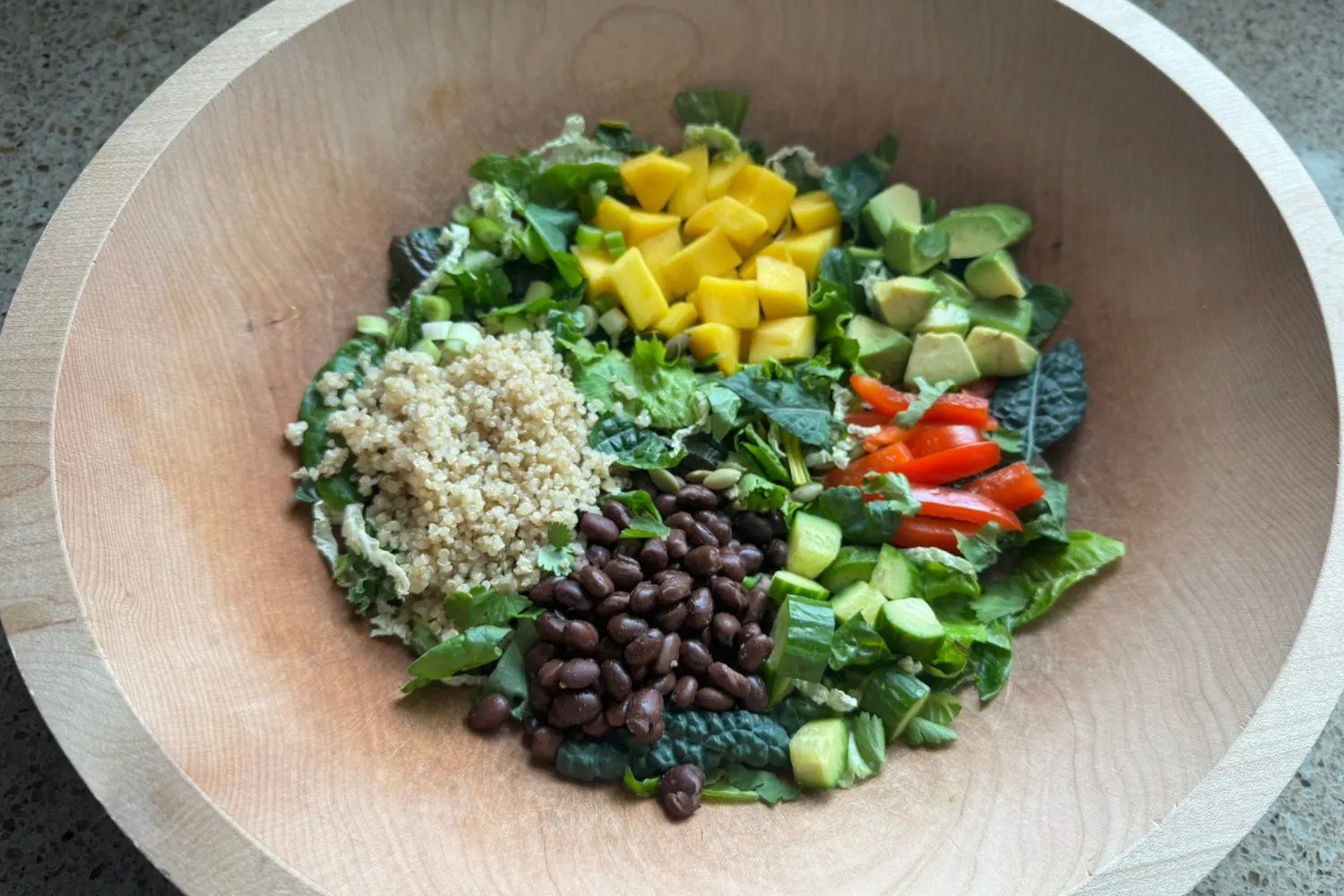 Colorful plant-based salad made with fresh vegetables grown in a Tower Garden.