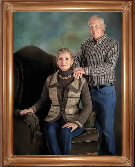 Retired husband standing and wife sitting with his hand on her shoulder in a painted portrait.