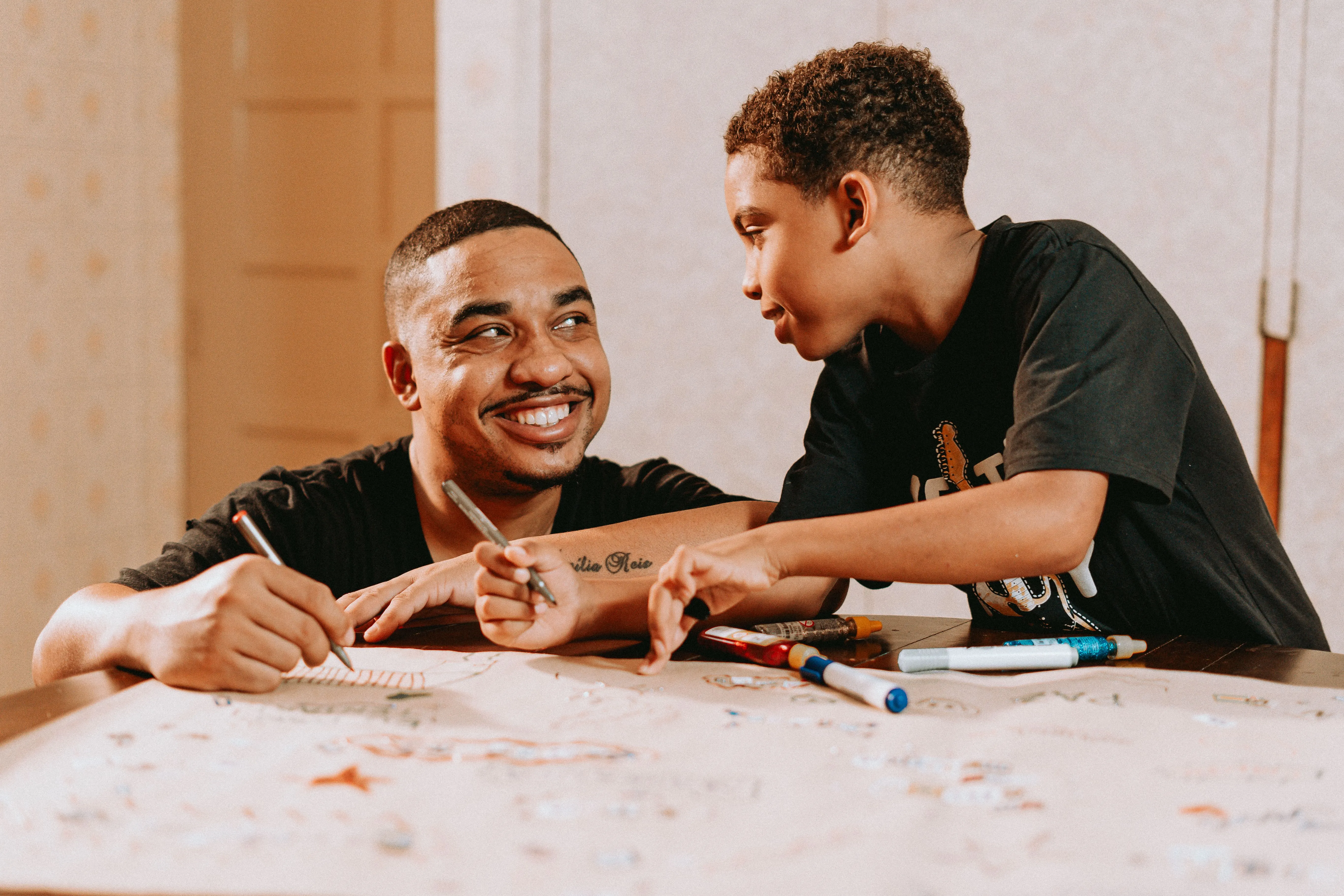 A black father directing the heir son.