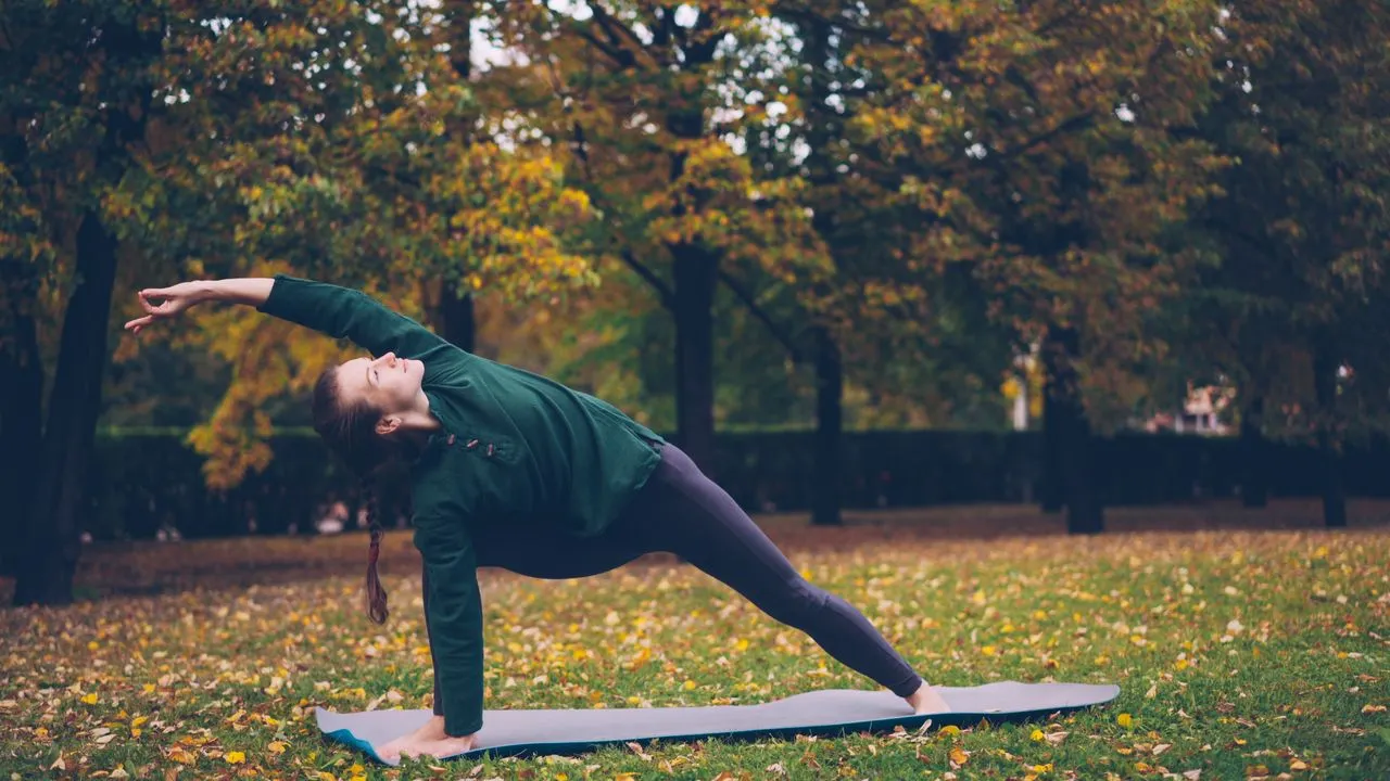Person practicing yoga as part of a healthy lifestyle