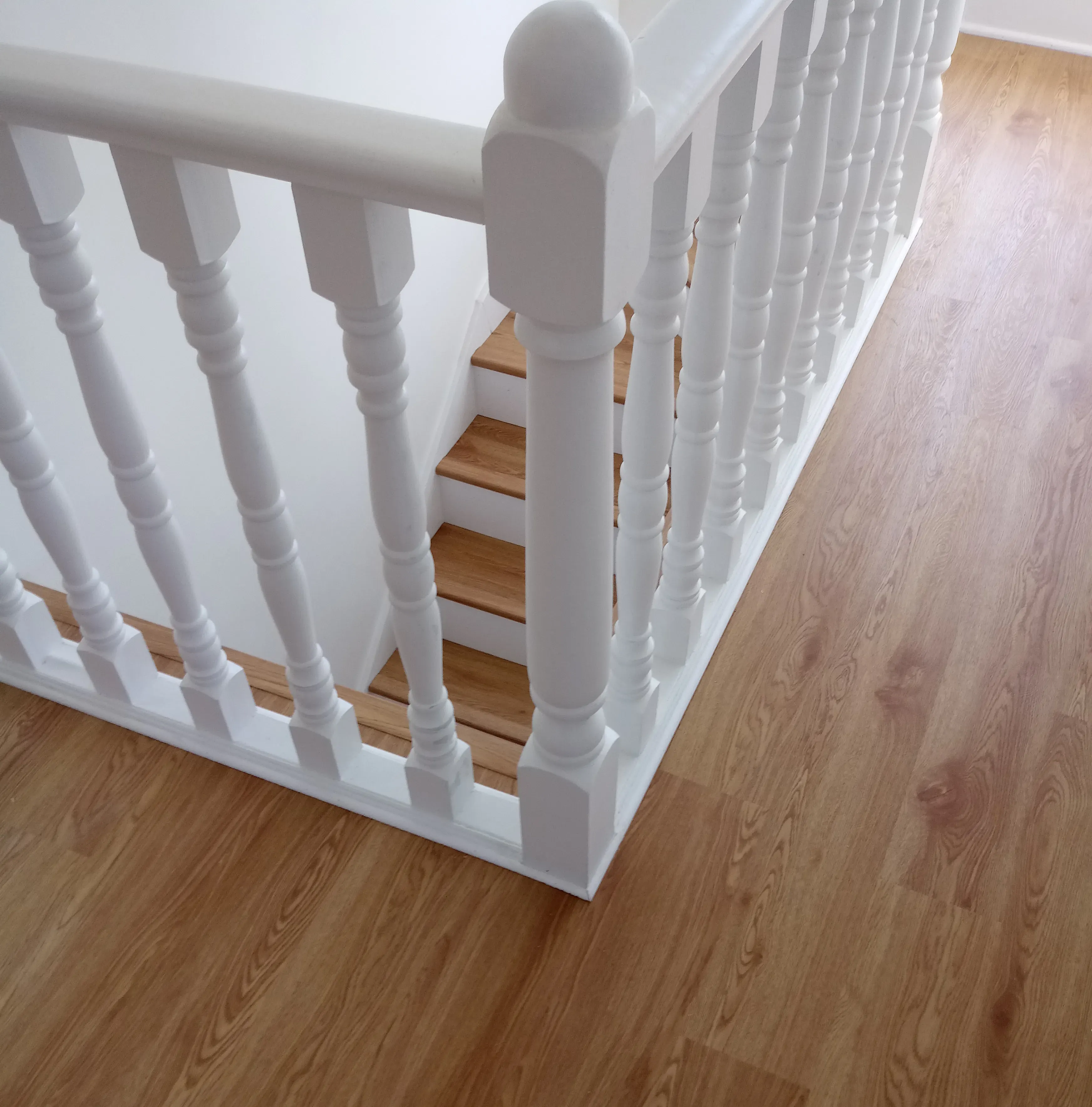 Completed wood floor installation upstairs and stairs