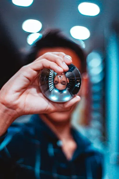 man looking into crystal ball