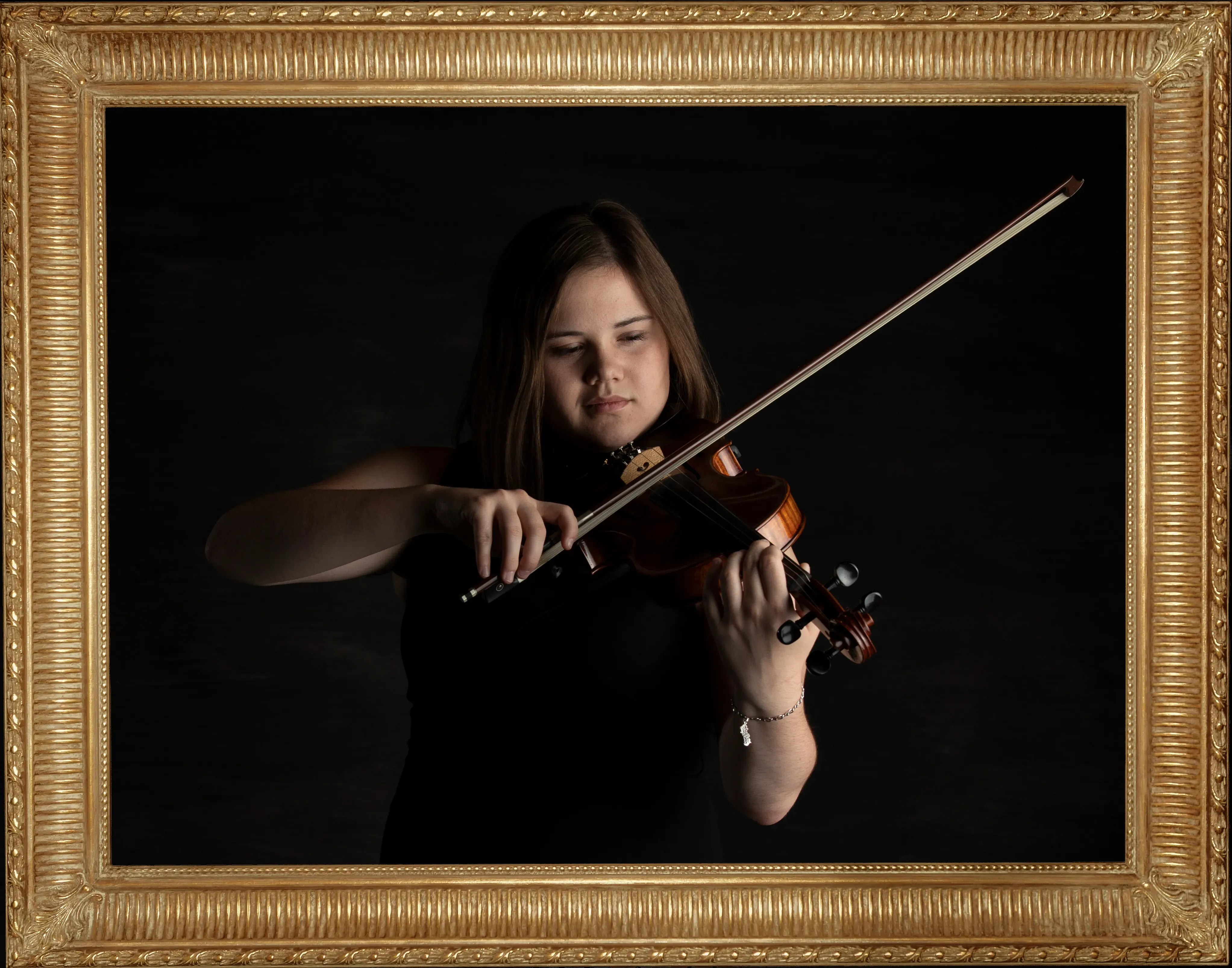 Young woman, Sophie May playing her violin in black framed with a museum quality frame 