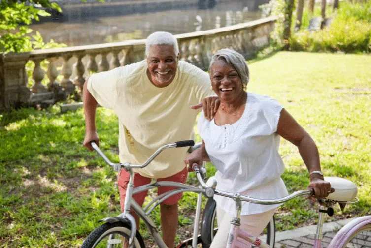 senior man and woman riding bikes