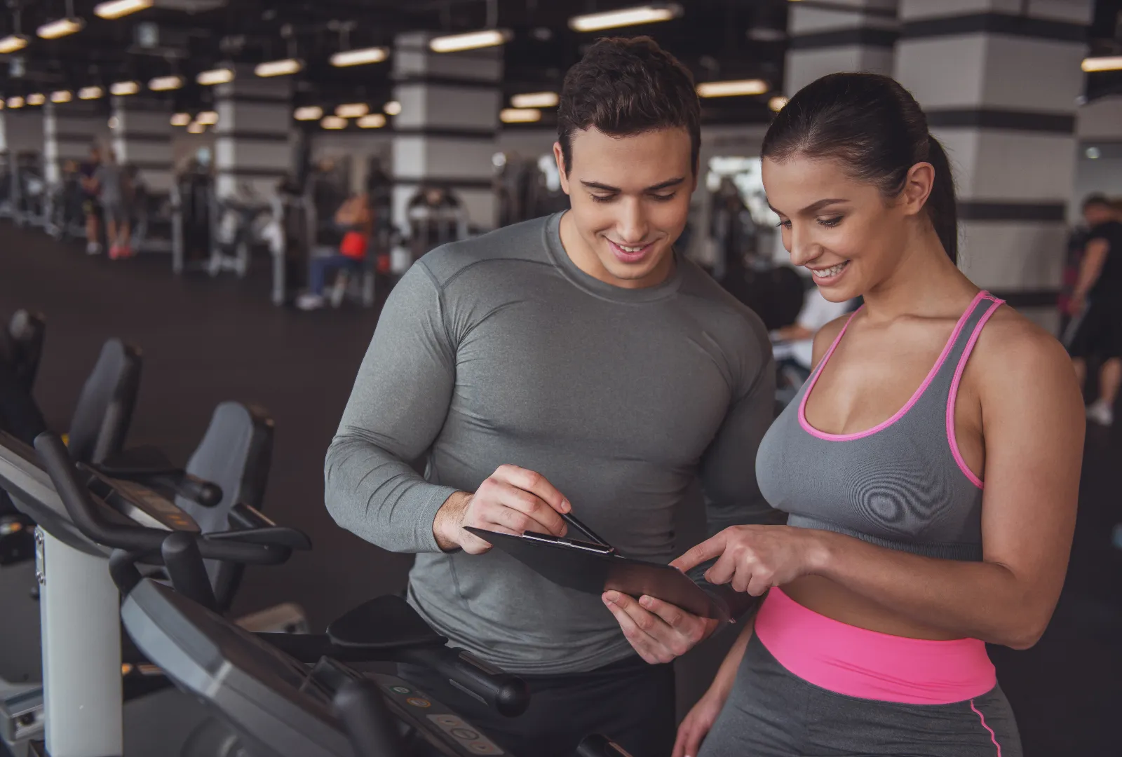Man and Woman Fitness Trainer at a gym