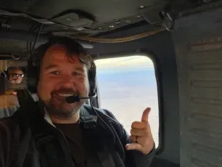 Eric Couch flying the Black Hawk helicopter to the National Training Center