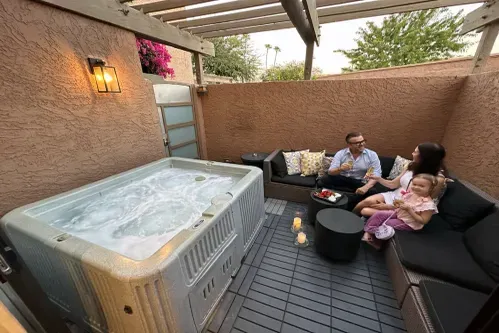 Relax in your own private oasis! Our outdoor patio offers a secluded Hot Tub SPA on the private patio; a serene oasis marked as a private pool amenity. Plus, enjoy the resort's shared pool for all guests and residents, just a pitch shot away.