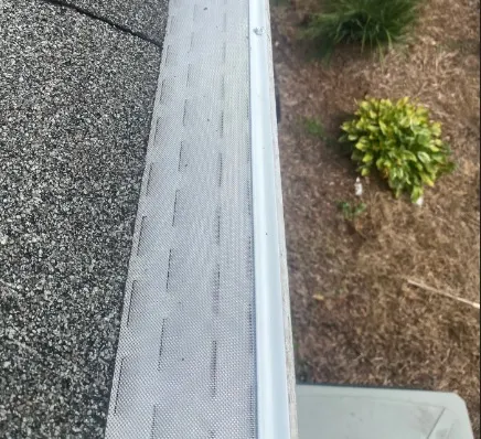 High-quality gutter guard protection system installed on a home near Badin Lake