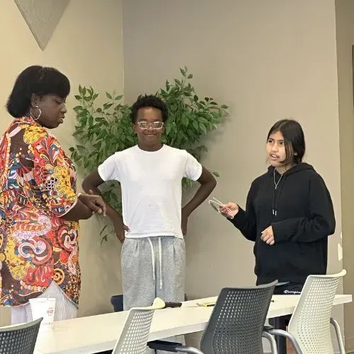 Students practicing customer service