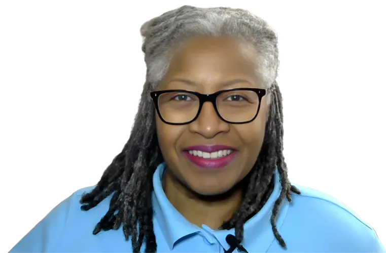 Close-up image of Dr. Lisa smiling, wearing black-rimmed glasses and a light blue shirt. She has gray hair styled in natural locs. The background is a digital design with dotted blue and purple patterns, featuring geometric triangular shapes, suggesting themes of innovation and transformation.