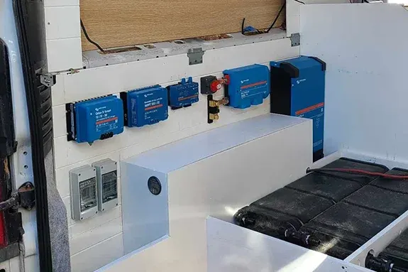 Campervan electrical system install featuring Victron Energy components, batteries, and off-grid power setup