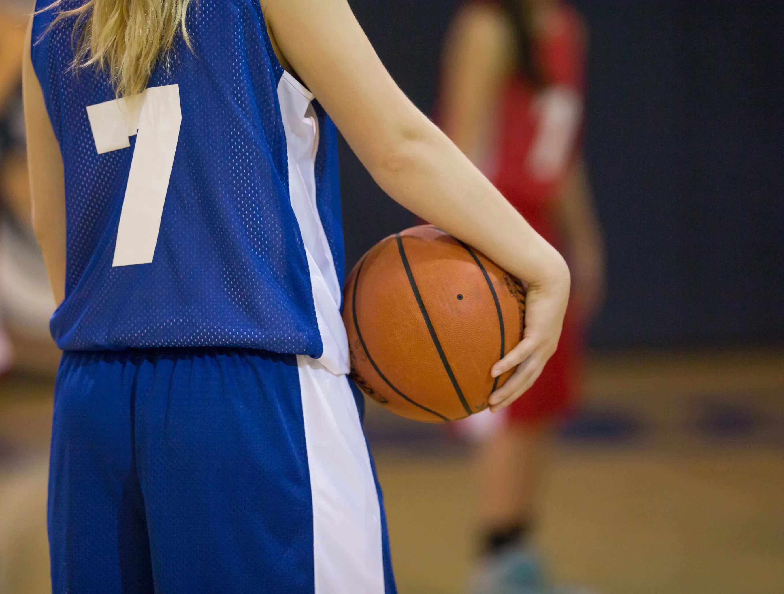 high school girl playing basketball
