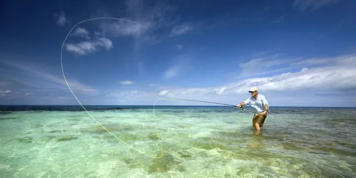 Belize fly fisherman casting