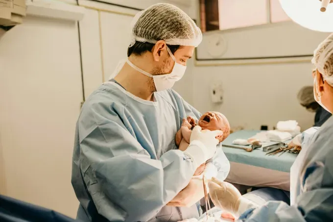 Pediatrician checking the baby