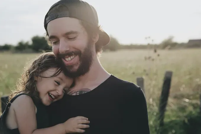 father playing with his daughter