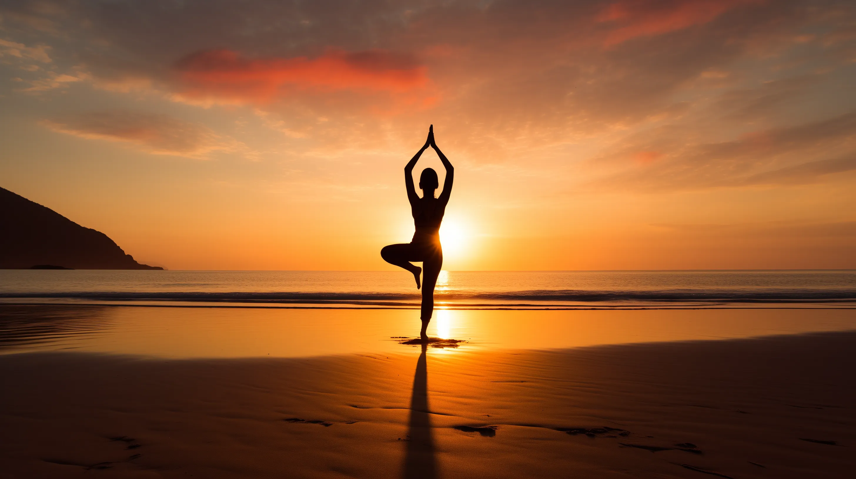 sunrise over tranquil beach, with solo silhouette in distance performing graceful yoga pose
