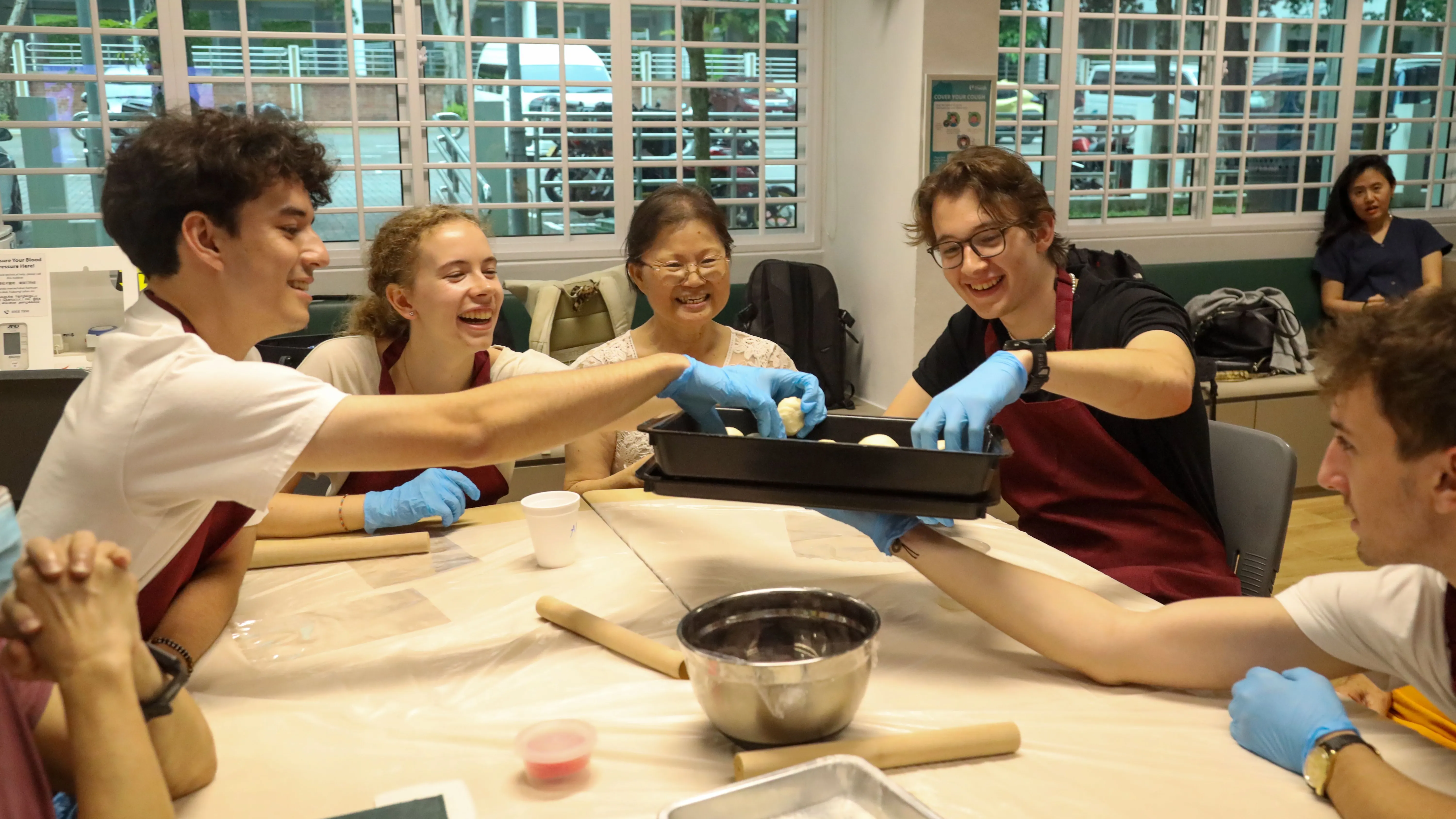 True Origins session at Mount Faber's / Telok Blangah's NTUC Health Active Ageing Centre with students from Saint Gallens University