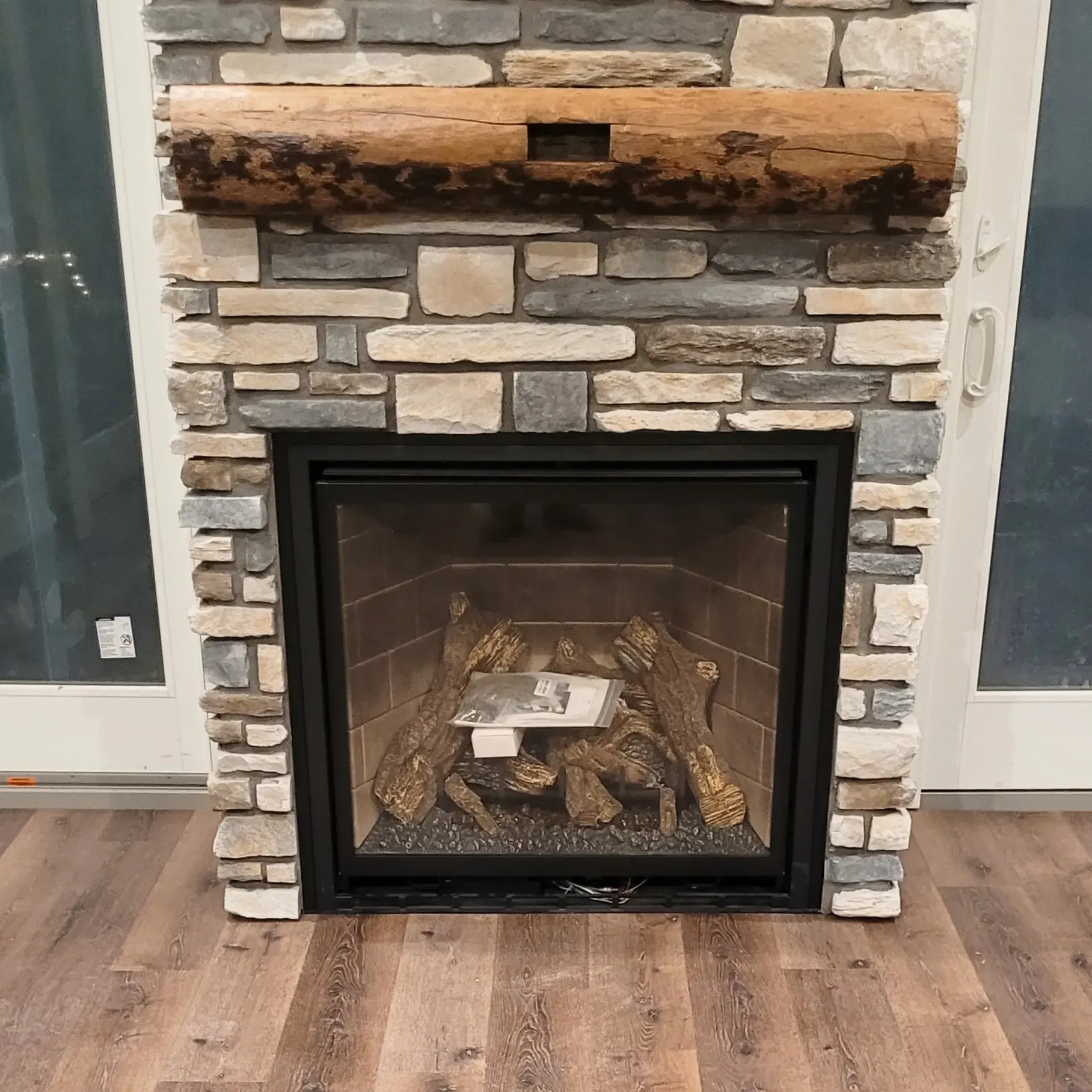 Custom fire place mantel made out of raw wood 