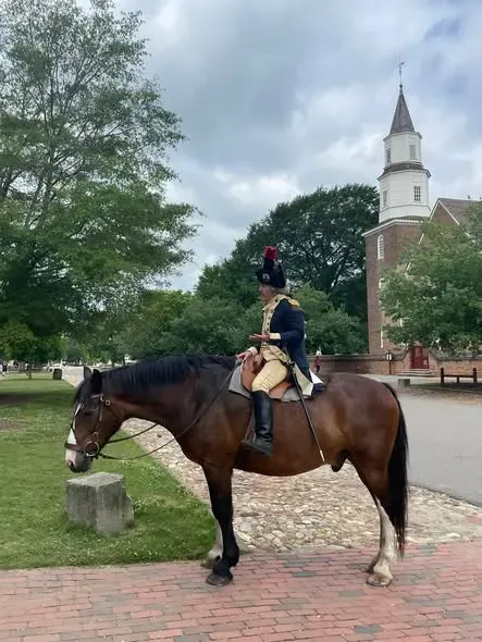 Mark Schneider on horseback near Bruton Parish Church in Colonial Williamsburg, portraying the Marquis de Lafayette