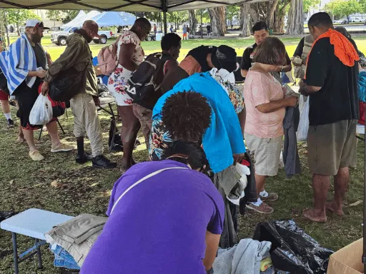 People picking out clothes and other donations July 29 2023 512x384