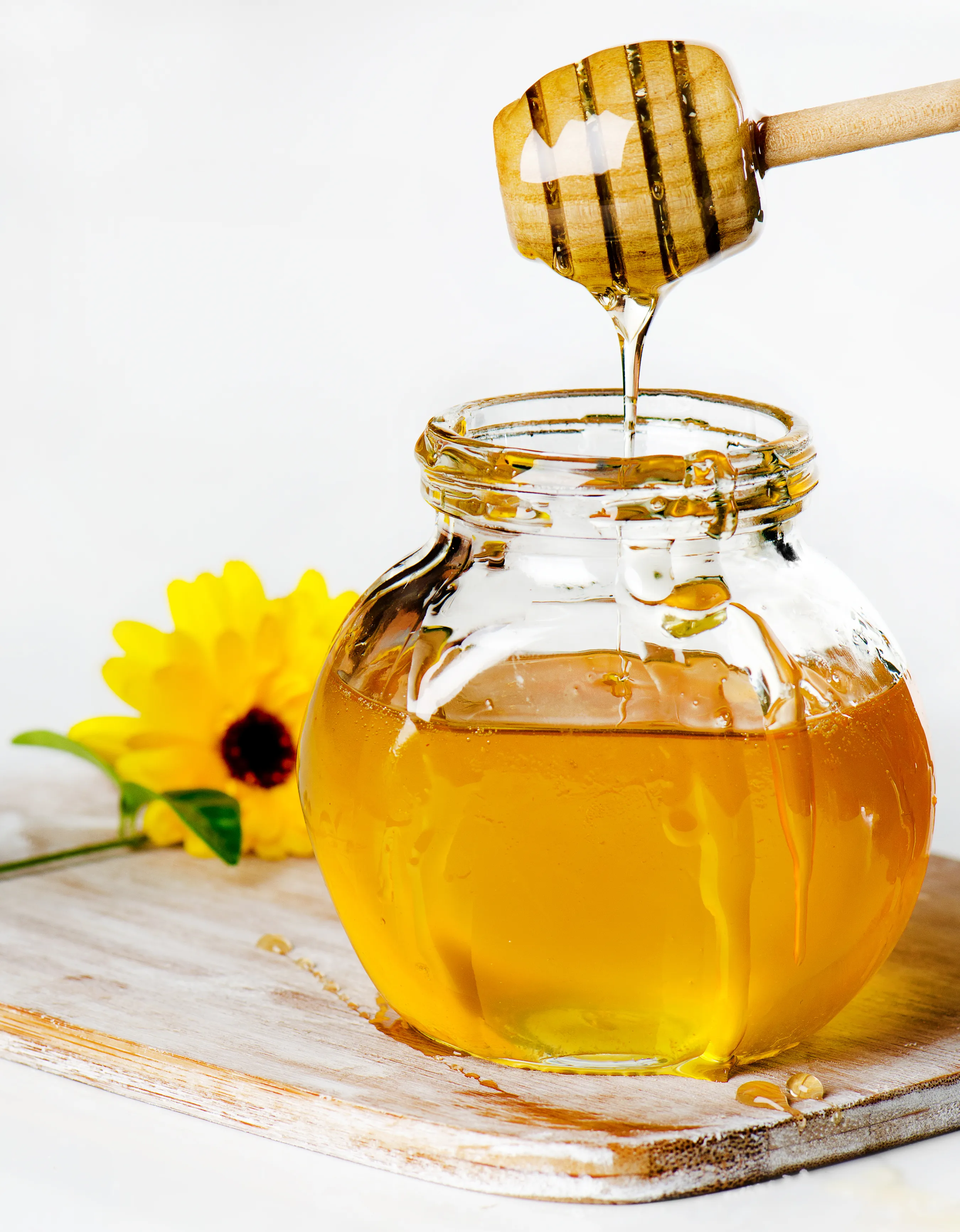Honey dripping into jar - kind words are like hony