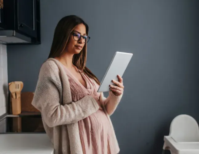 Pregnant woman preparing a baby 