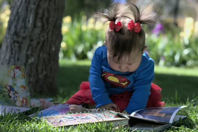 baby reading a book