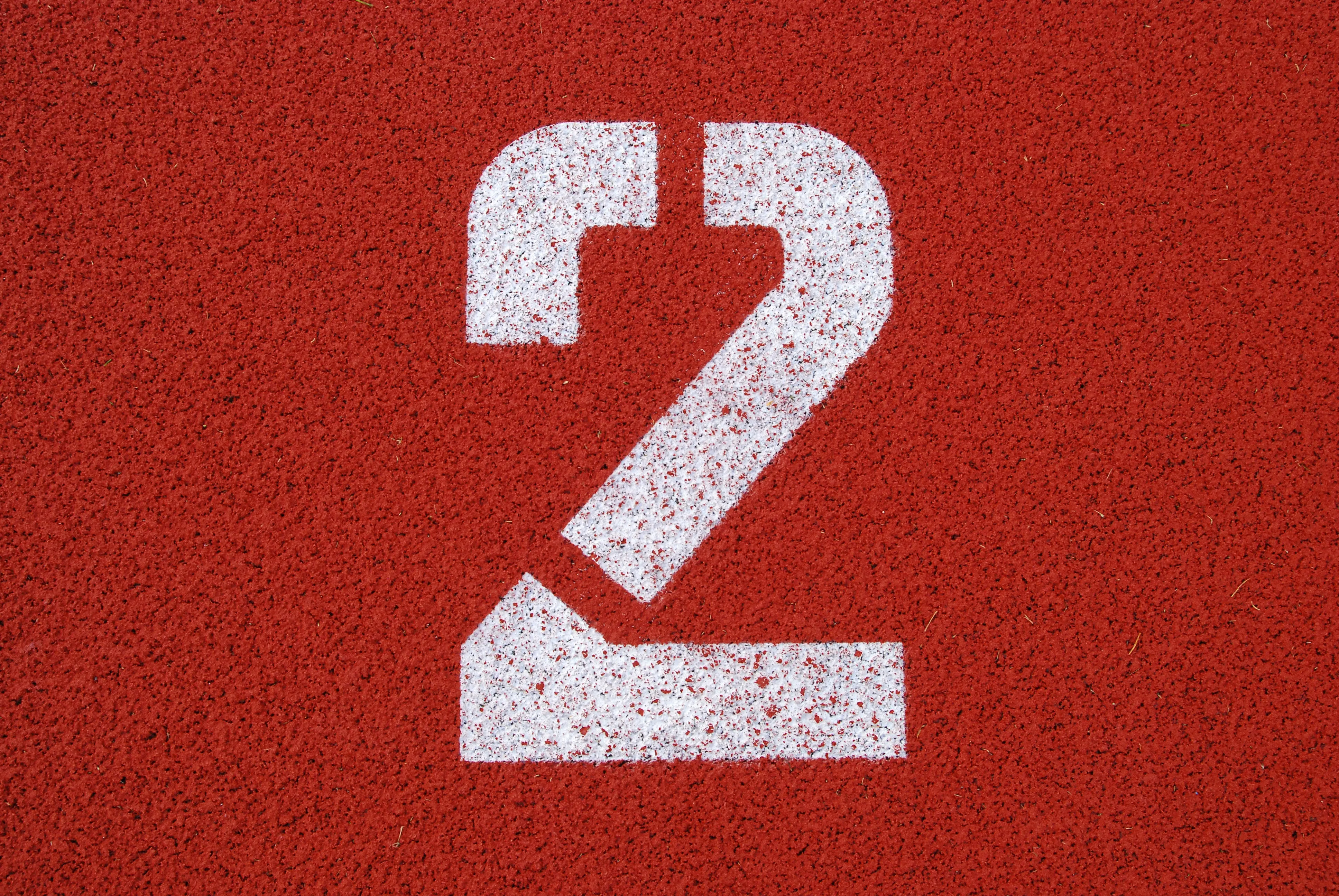 The number 2 on red background