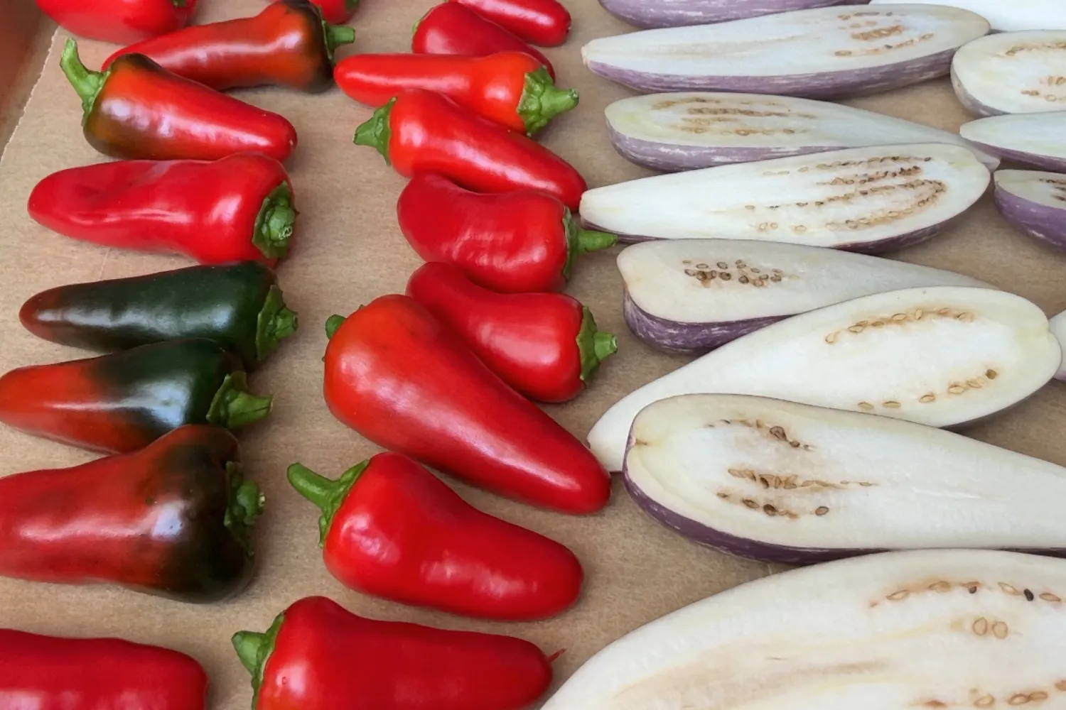 Fresh Tower Garden eggplants and peppers sliced and ready for cooking.