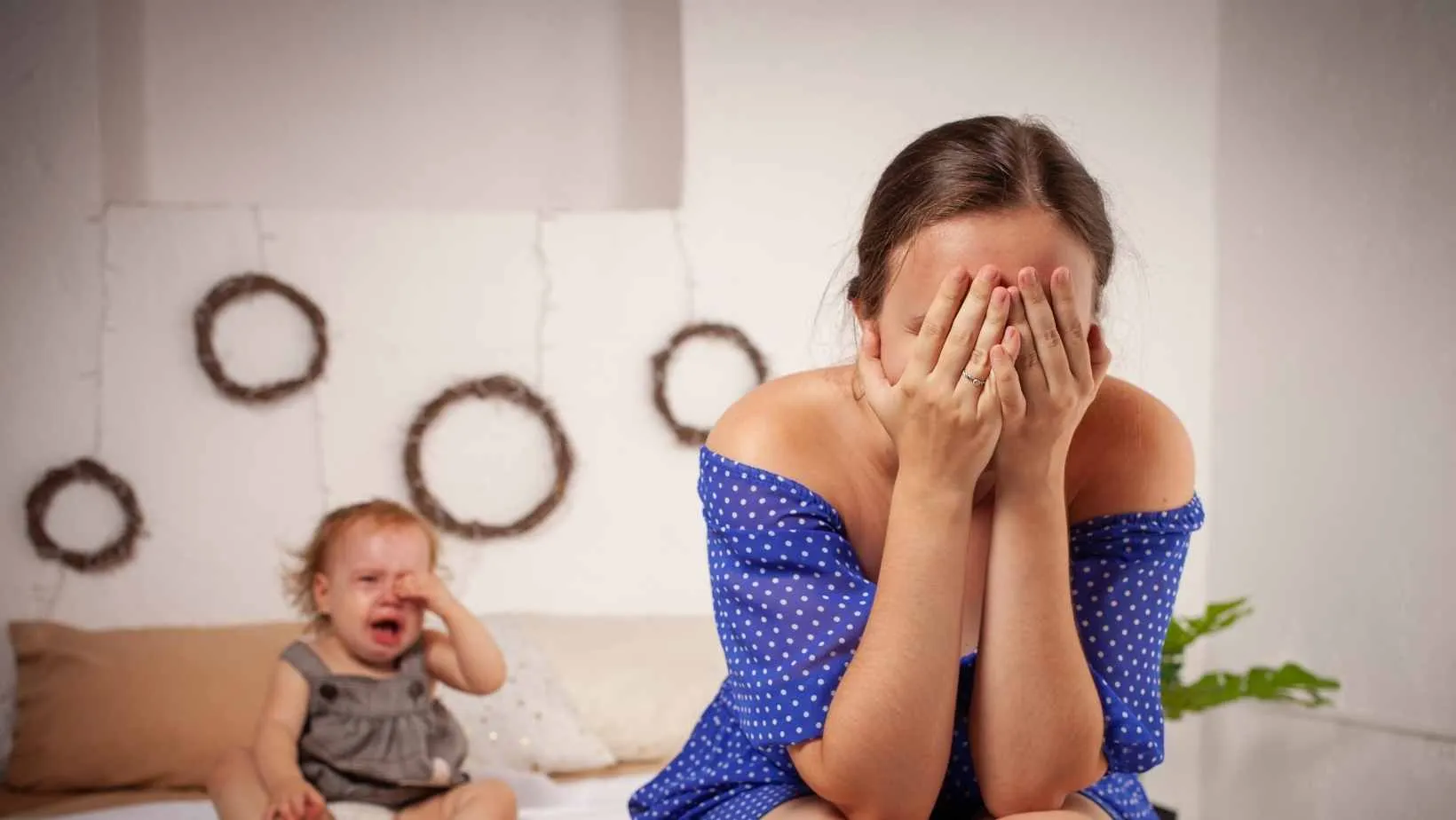 Distressed mom with crying baby