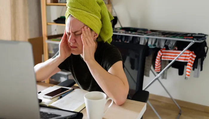 A mom with a towel on her head, not feeling like she has enough time in the day.