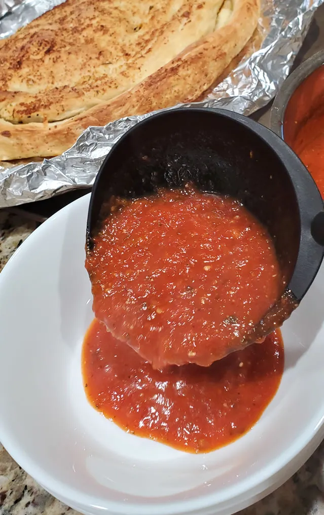 Prepare Bowls With Marinara Sauce For Calzone Dipping