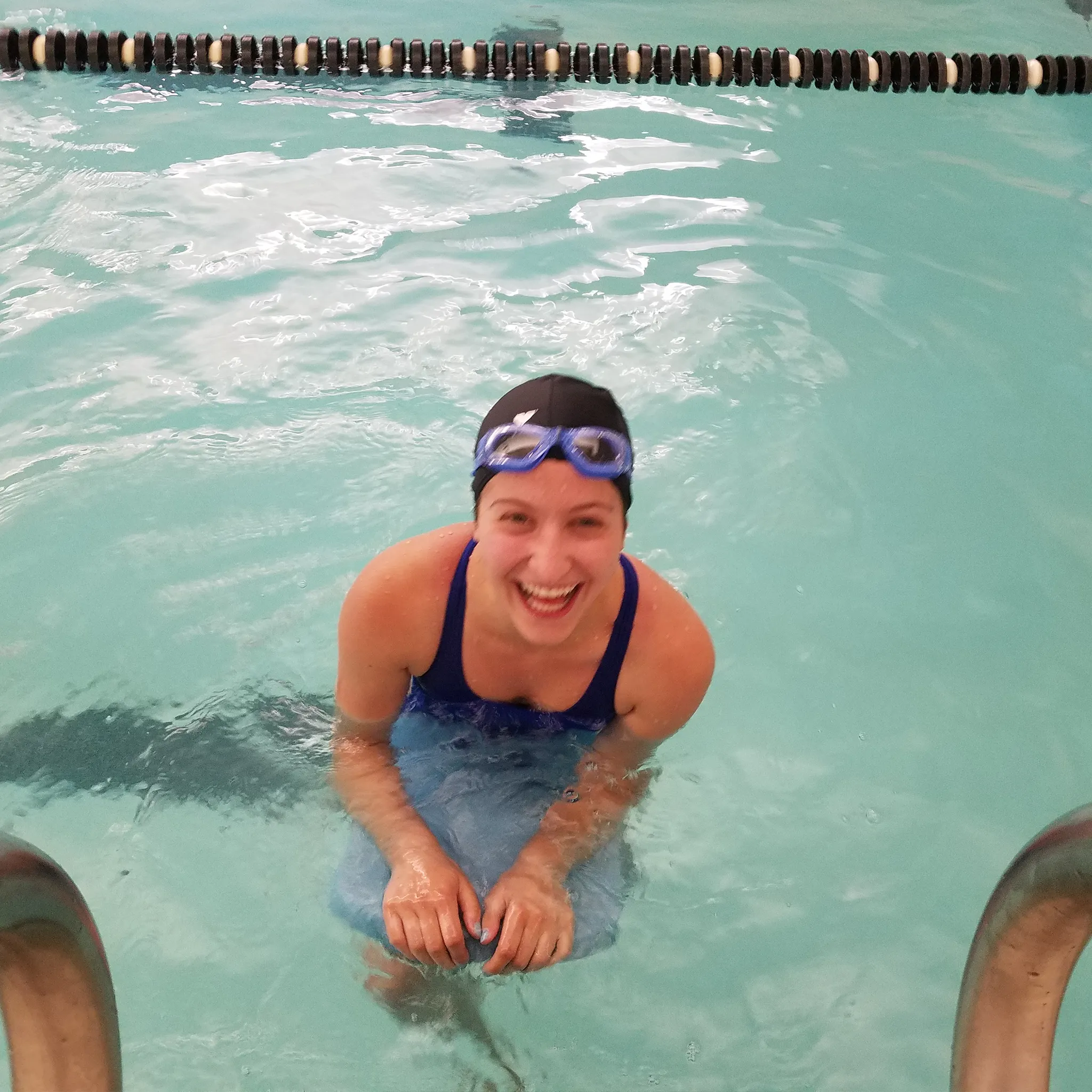 Swimming in an indoor pool, highlighting a form of exercises promoted by Azael Montejo Jr for over overall fitness and well-being