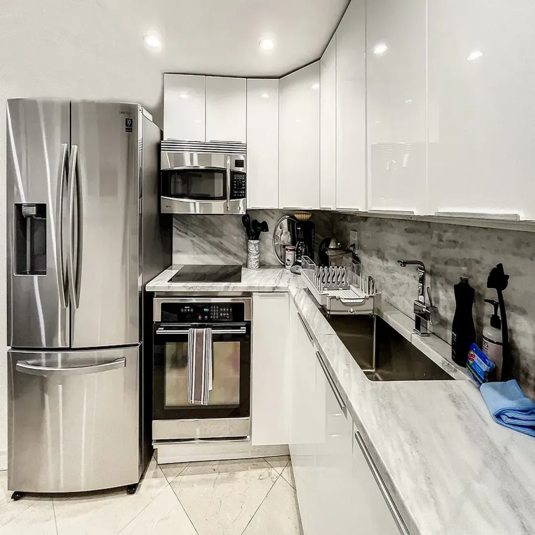 Villa Laurell Estate kitchen with stainless steel appliances, state-of-the-art induction cooking, convection oven, Nespresso machine, and blender.