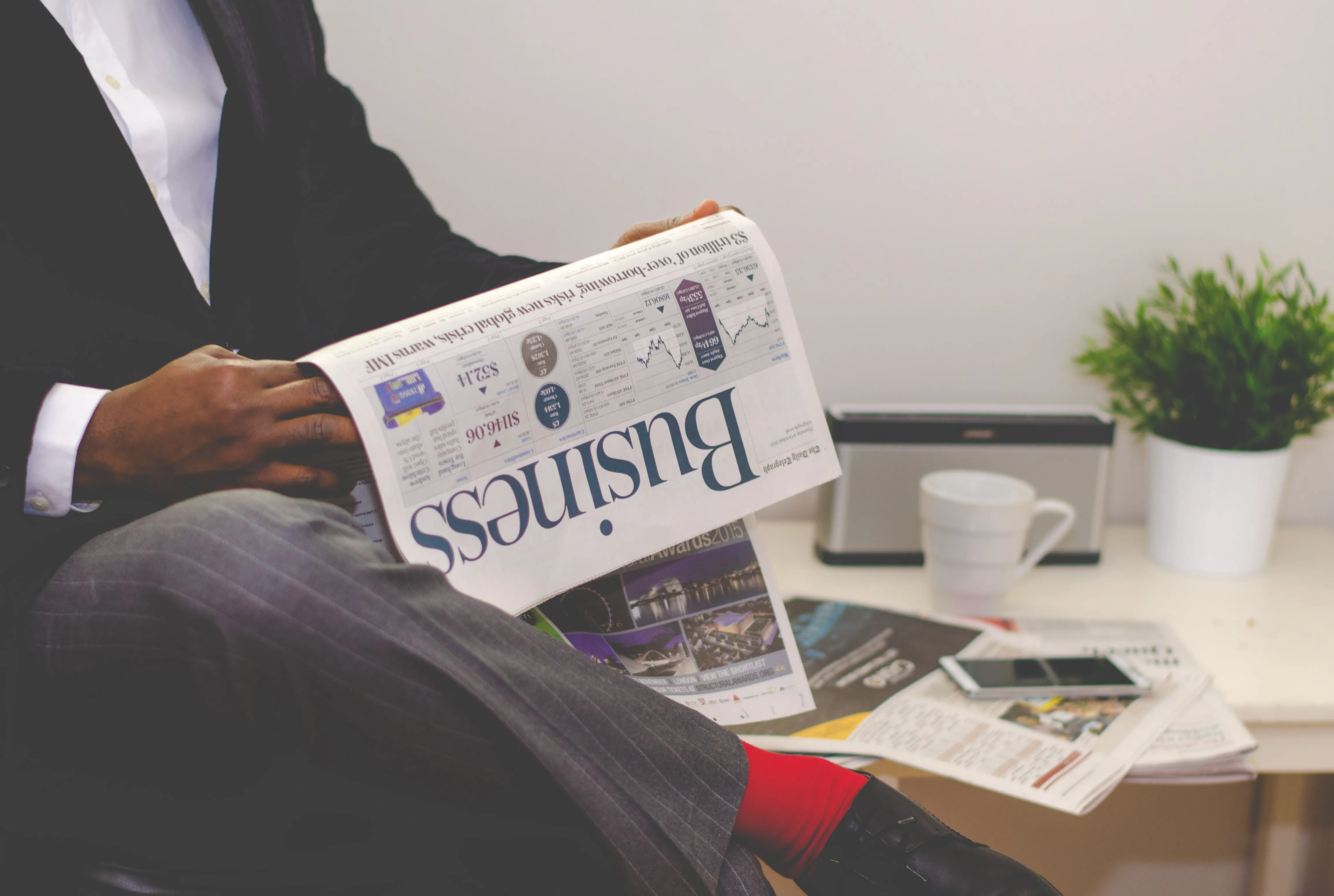 Media - Man reading newspaper