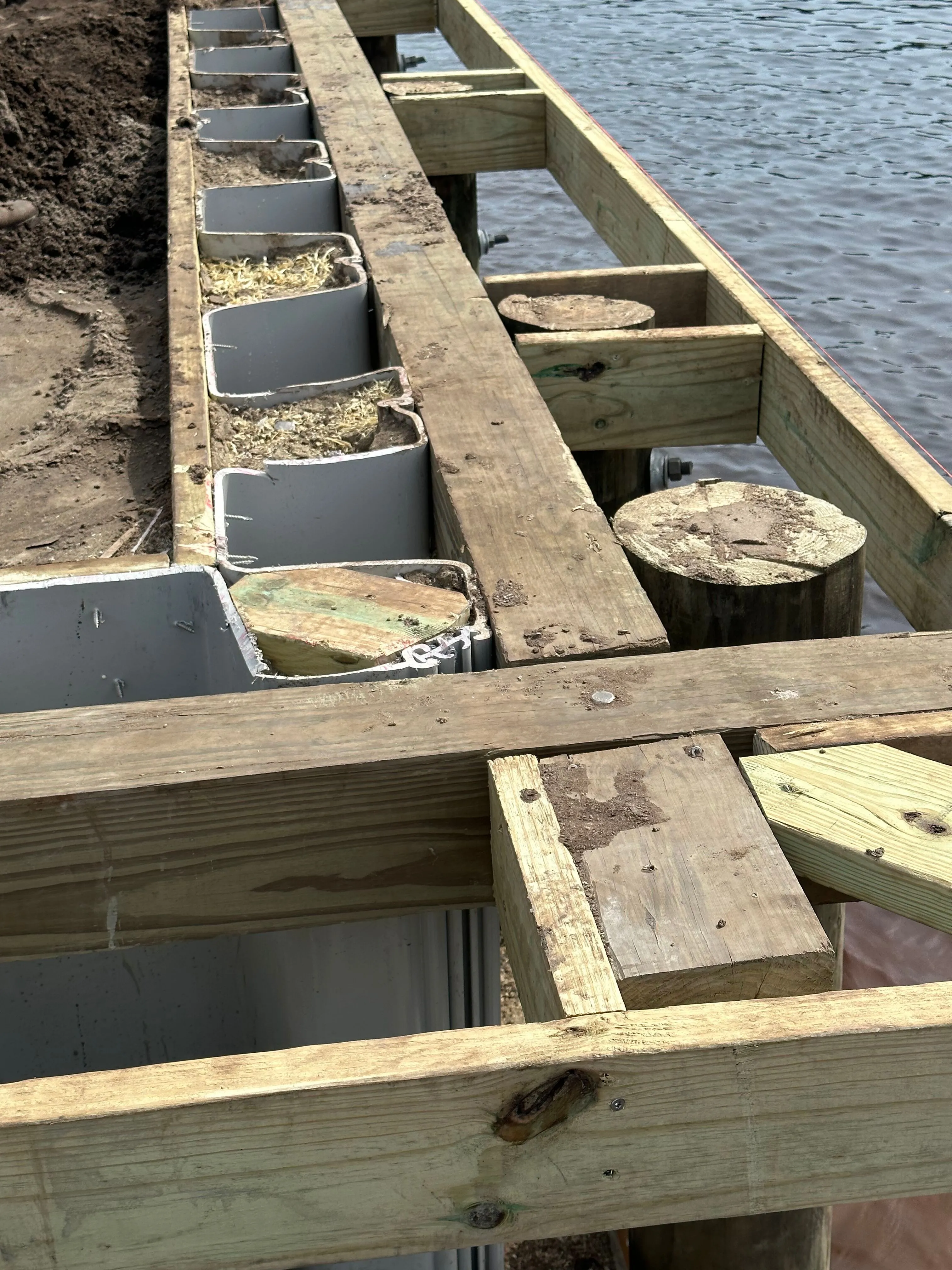 Super Strong Vinyl Bulkhead framed out for composite wood cap under construction in Myrtle Beach SC on the Intracoastal Waterway built by Waterbridge Contractors of the Carolinas
